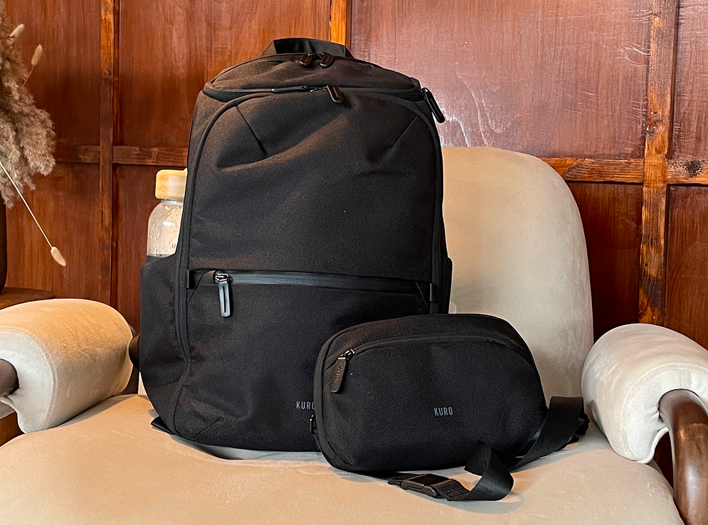The Kuro backpack and detachable sling bag side by side on a chair