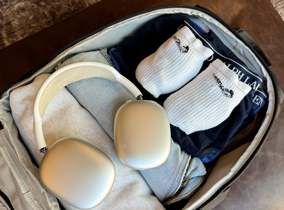 The Switchpack opened flat with clothes and headphones packed inside